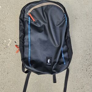 Cotopaxi Black Backpack with Blue and Red Details